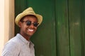 Happy guy with hat and sunglasses Royalty Free Stock Photo