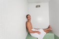 Happy guy laid inside the sauna Royalty Free Stock Photo