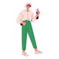 Happy guy wearing stylish summer outfit. Young man in hat holds cool drink glass, walking. Person in trousers, shirt Royalty Free Stock Photo