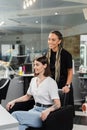 happy hairdresser and female client in Royalty Free Stock Photo