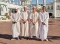 Happy, hajj and Muslim men at a mosque to pray, ramadan faith and group in Mekka together. Smile, religion and portrait