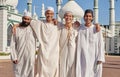 Happy, hajj and Muslim men at a mosque to pray, ramadan faith and group in Mekka together. Smile, religion and portrait