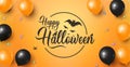 Happy Halloween Banner with Halloween lettering on orange background with candies and gold and black air balloons and traditional