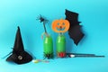 Happy Halloween, bottles with green cocktail, witch hat, mystical decor on a bright background