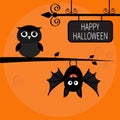 Happy Halloween card. Bat hanging on tree. Royalty Free Stock Photo