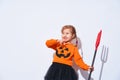 Happy Halloween. A child in a devil costume with a Trident and horns