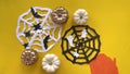 Stop motion animation with DIY figures of bats and spiders made of craft paper and moving white and gold pumpkins. Magic, devilry