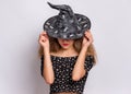 Teen girl in witch black hat