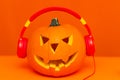 Happy Halloween decorations festival and music concept background.Mix variety candle items and pumpkin listening music Royalty Free Stock Photo