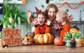 Happy Halloween! family mother and children getting ready for ho Royalty Free Stock Photo