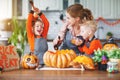 Happy Halloween! family mother and children getting ready for ho Royalty Free Stock Photo