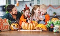 Happy Halloween! family mother father and children cut pumpkin f Royalty Free Stock Photo