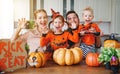 Happy Halloween! family mother father and children cut pumpkin f Royalty Free Stock Photo