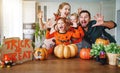 Happy Halloween! family mother father and children cut pumpkin f Royalty Free Stock Photo