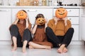 Happy halloween. happy family mother father and daughter preparing for Halloween and having fun at home on the kitchen Royalty Free Stock Photo