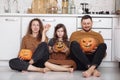 Happy halloween. happy family mother father and daughter preparing for Halloween and having fun at home on the kitchen Royalty Free Stock Photo