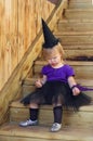 Happy Halloween. Funny baby girl in carnival costume outdoors