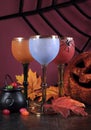 Happy Halloween ghoulish party cocktail drinks with color goblets Royalty Free Stock Photo