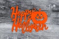 Happy Halloween greeting on a weathered wood