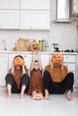 Happy halloween. happy family mother father and daughter preparing for Halloween and having fun at home on the kitchen Royalty Free Stock Photo