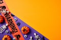 Happy Halloween holiday concept. Halloween decorations, pumpkins, skeletons, tape WARNING on orange and purple background.