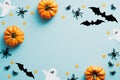 Happy halloween holiday concept. Halloween decorations, bats, ghosts, spiders, pumpkins on blue background. Halloween party Royalty Free Stock Photo