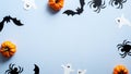 Happy halloween holiday concept. Halloween decorations, ghosts, pumpkins, bats, spiders on blue background. Halloween party banner Royalty Free Stock Photo