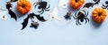 Happy halloween holiday concept. Halloween decorations, ghosts, pumpkins, bugs, bats, spiders on blue background. Halloween party Royalty Free Stock Photo