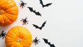Happy Halloween holiday concept. Halloween decorations, pumpkins, spider, bats on white background. Flat lay, top view Royalty Free Stock Photo