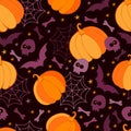 Happy Halloween holiday seamless pattern. Holiday background with scary pumpkins, bat, skull, bones, spider webs and skeleton. Royalty Free Stock Photo