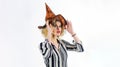 Happy Halloween holiday. Sexy woman in witch hat ready for Haloween party. Female wizard fairy character for All Saints