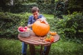 Happy halloween. Man carving big pumpkin Jack O Lanterns for Halloween outside. Close-up Royalty Free Stock Photo