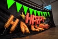 Happy Halloween orange balloon letters are prepared on the 2nd floor for hang on to the terrace with pumkin flag and black cloth