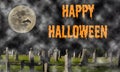 Happy Halloween - spooky graveyard (with mist) with a large moon & bat silhouettes Royalty Free Stock Photo