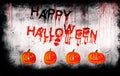 Happy Halloween painted on bloody wall with pumpkins Royalty Free Stock Photo