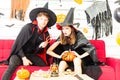 Happy Halloween party concept. Young man and woman wearing as vampires, witch or ghost celebrate the halloween festival