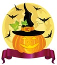 Happy Halloween pumpkin with a witch hat. Ribbon for text. Royalty Free Stock Photo