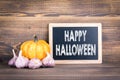 Happy Halloween, pumpkins and garlic Royalty Free Stock Photo