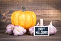 Happy Halloween, pumpkins and garlic Royalty Free Stock Photo