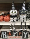 Happy Halloween. Skeleton and cat statues in a shop