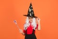 Happy halloween. smiling child in witch hat. kid hold magic wand. childhood happiness. teen girl ready to celebrate