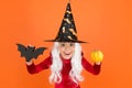 Happy halloween. smiling little girl halloween party. devil inside. spooky witch. jack o lantern. small child witch hat