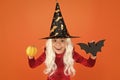 Happy halloween. smiling little girl halloween party. devil inside. spooky witch. jack o lantern. small child witch hat