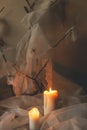 Happy Halloween! Spooky spider web, spiders and glowing candles in dark. Scary atmospheric halloween party decorations, close up. Royalty Free Stock Photo