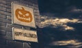 Happy halloween street sign with scary pumpkin Royalty Free Stock Photo