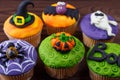 Happy Halloween sweets set. Tasty cupcakes with bright decoratio Royalty Free Stock Photo