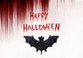 Happy Halloween text. Bat on bloody background.