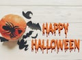 Happy halloween text flat lay. jack lantern pumpkin with witch g Royalty Free Stock Photo