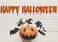 Happy halloween text flat lay. jack lantern pumpkin with witch g Royalty Free Stock Photo