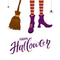 Happy Halloween with witches legs in purple shoes and broom Royalty Free Stock Photo